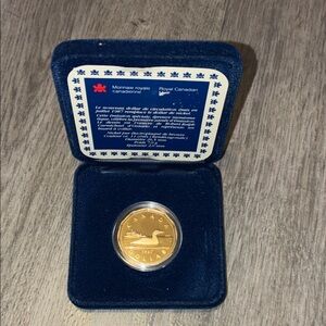 Royal Canadian Mint Gold Loon Coin in Blue Velvet Display